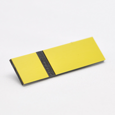 Gul-sort graveringsplate